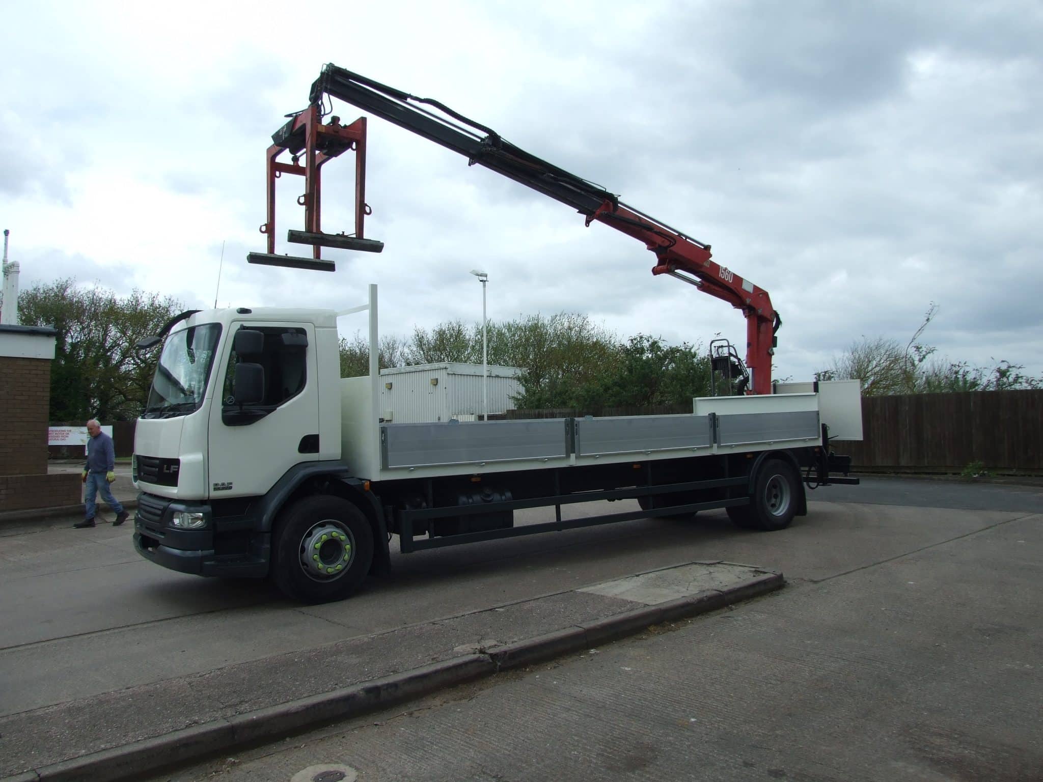 Passenger side view of used DAF crane truck